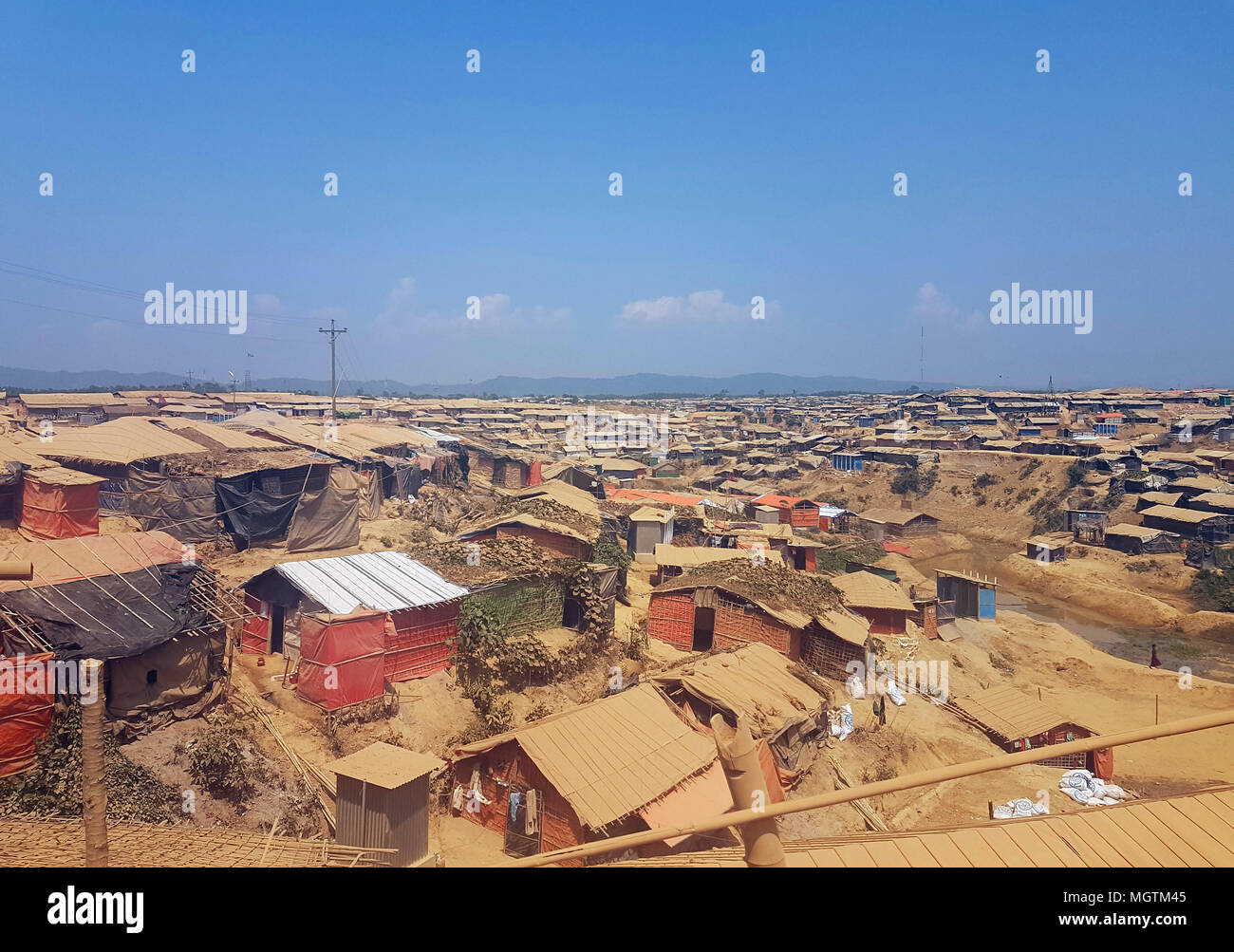 14 April 2018, Bangladesh, Cox·s Bazar: Tightly packed huts in a Rohingya refugee camp. Devastating damage through flooding and landslides are feared as the monsoon season approaches. Photo: Nick Kaiser/dpa Stock Photo