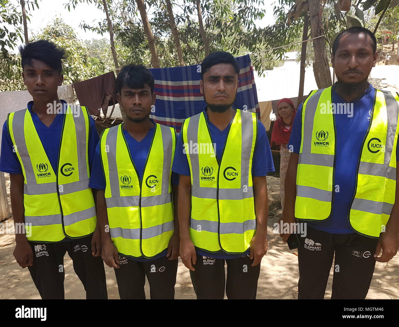 13 April 2018, Bangladesh, Cox·s Bazar: Four members of an 'Elephant defence team' standing in the Kutupalong Rohingya refugee camp, the world's most populous refugee camp. Since much forest had to be felled to make room for this and other camps, encounters with wild elephants are a regular occurrence. Several refugees have been trampled to death. Photo: Nick Kaiser/dpa Stock Photo