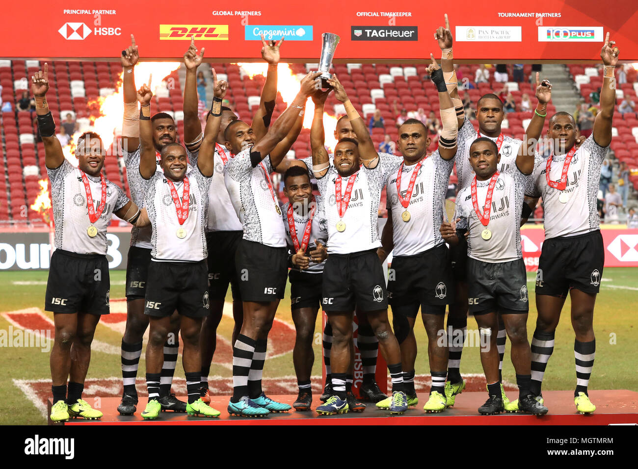 Singapore. 29th Apr, 2018. Fijian players celebrate after winning the Cup Final match between Fiji and Australia at the Rugby Sevens tournament at the National Stadium. Singapore. Credit: Paul Miller/ZUMA Wire/Alamy Live News Stock Photo
