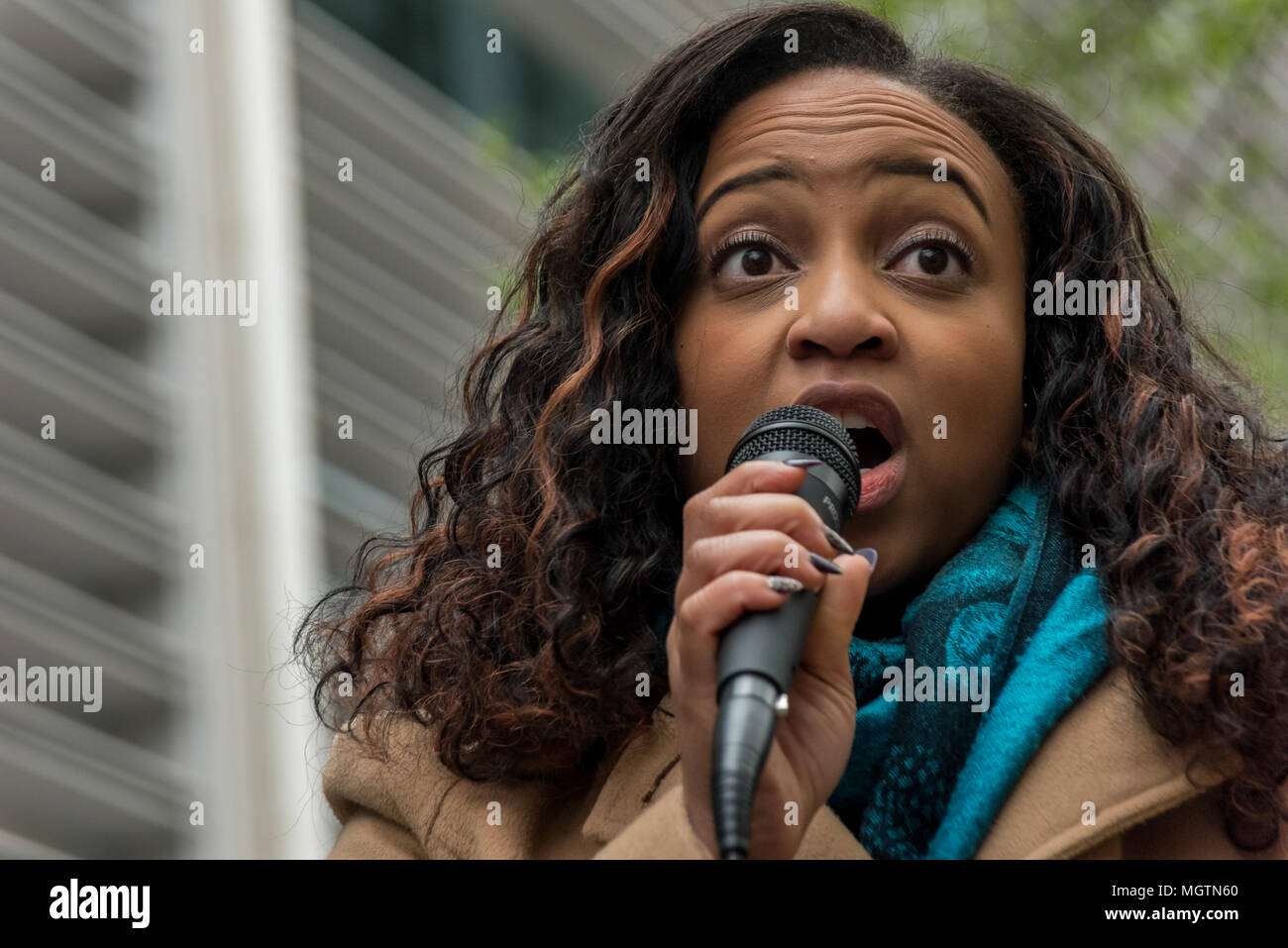 London, UK. 28 April 2018. Protest organiser Sara Burke speaks outside the Home Office in a protest she called because she wasl disgusted by the government's incompetence and deliberately targeted attacks on legal immigrants. She wrote on Facebook that ''the government's abhorrent treatment of those from the Windrush generation is a national embarrassment'' and planned the march to the Home office to put pressure on them to keep their promises to these people. Credit: ZUMA Press, Inc./Alamy Live News Stock Photo
