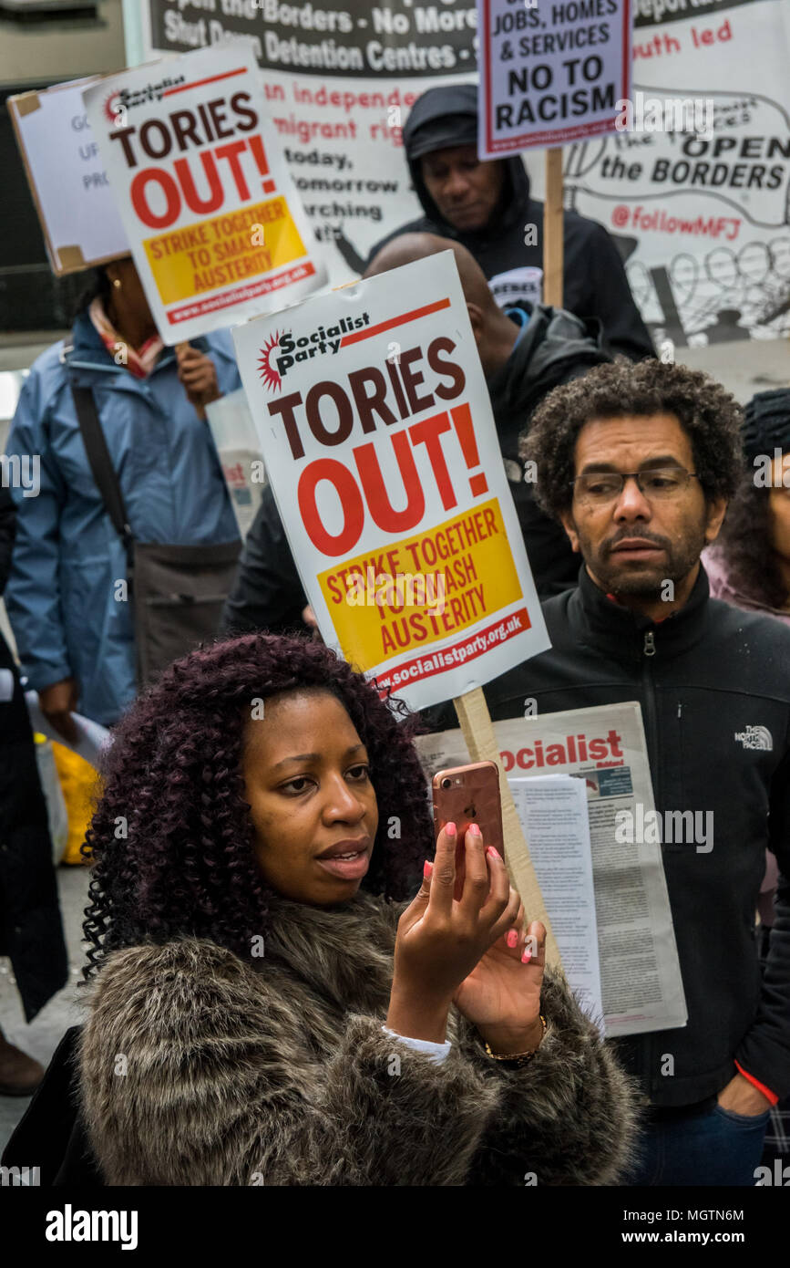 London, UK. 28 April 2018. People with placards at the protest outside the Home Office. The protest was called by an individual disgusted by the government's incompetence and deliberately targeted attack on legal immigrants. Organiser Sara Burke wrote that ''the government's abhorrent treatment of those from the Windrush generation is a national embarrassment'' and planned the march to the Home office to put pressure on them to keep their promises to these people. Credit: ZUMA Press, Inc./Alamy Live News Stock Photo