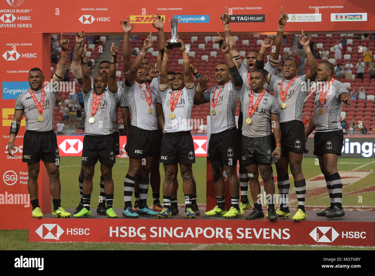 Singapore. 29th April 2018. Fiji's players lift the trophy after winning the final of the HSBC World Rugby Sevens Series Singapore Cup in Singapore, on April 29, 2018. Credit: Then Chih Wey/Xinhua/Alamy Live News Stock Photo