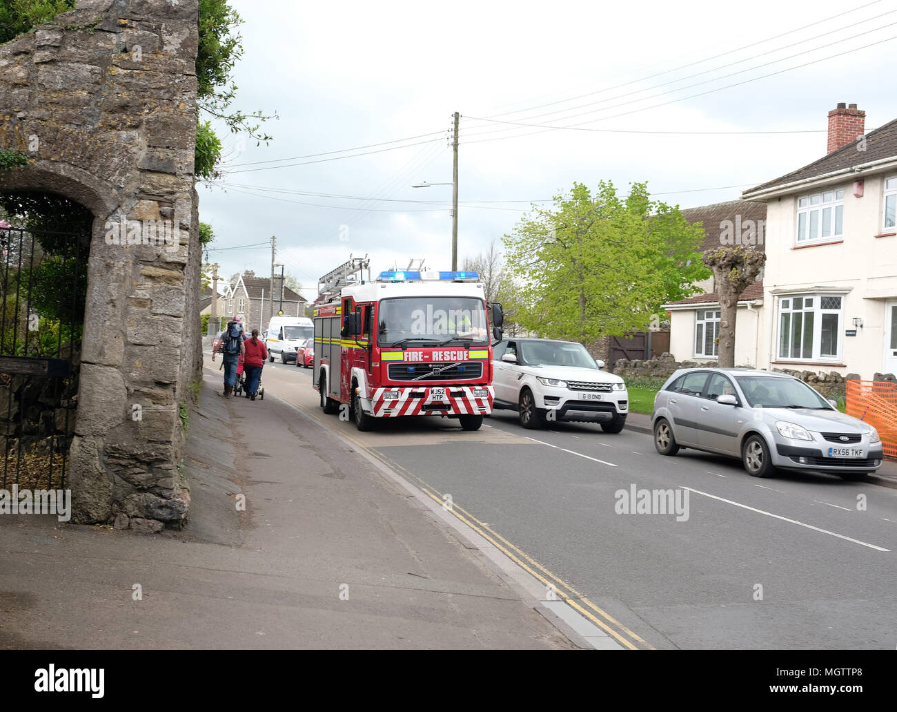 Cheddar, UK. 29 April 2018. - Follow a traffic collision in the Somerset village of Cheddar emergency crew race to the scene past stationary traffic. The accident was fatal for the driver of the only car involved, a man in his 30's Credit: Timothy Large/Alamy Live News Stock Photo