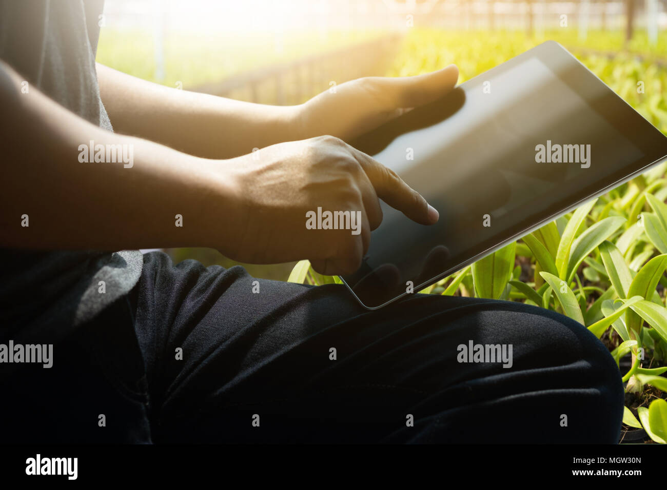 hand tablet man working using a digital tablet laptop computer Stock Photo