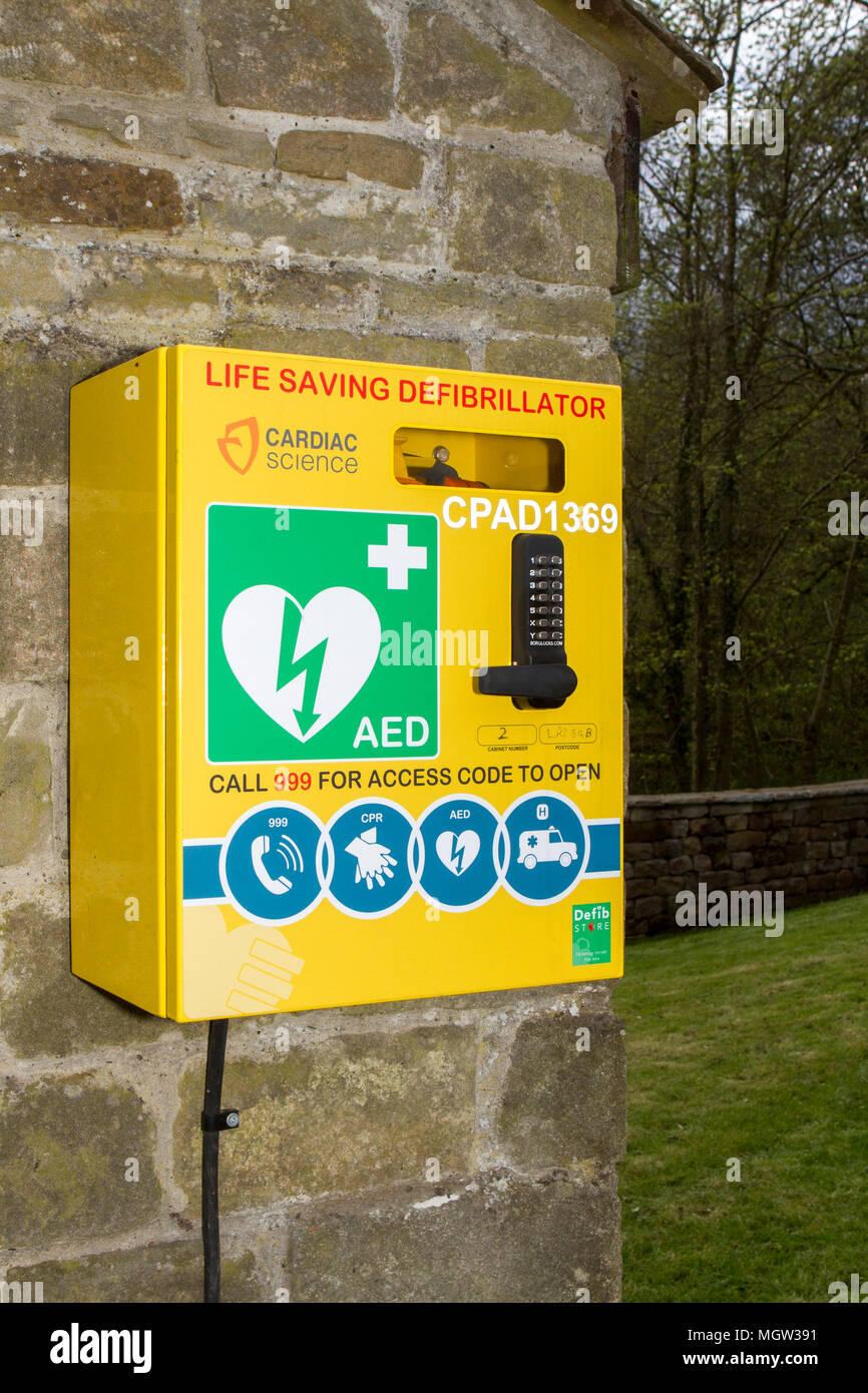 A wall mounted heart defibrillator for emergency resuscitation of a