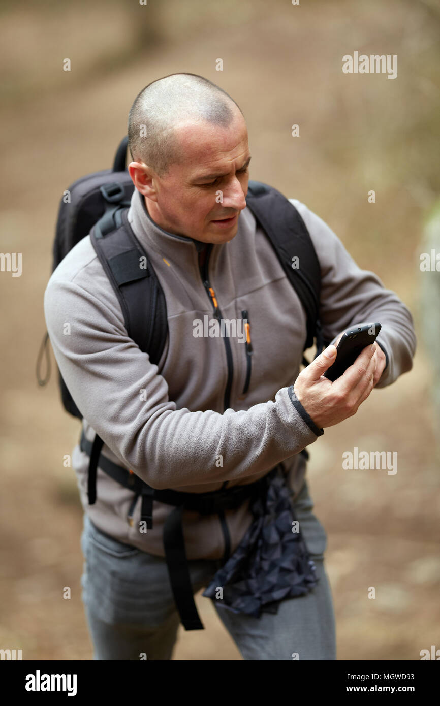 Checvking A Rmap Hiker checking gps map hi-res stock photography and images - Alamy