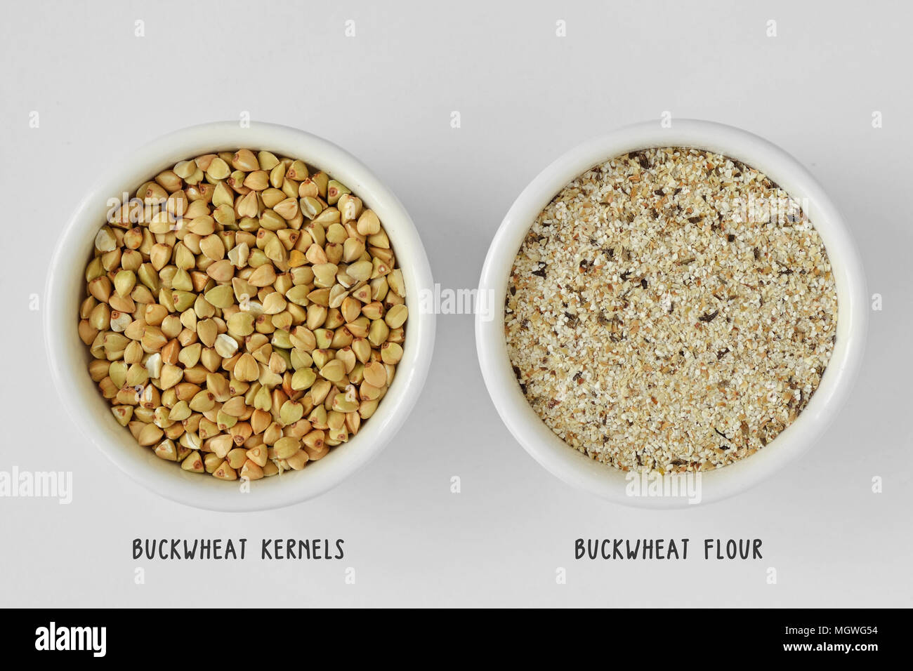 Buckwheat kernels and buckwheat flour in bowl Stock Photo