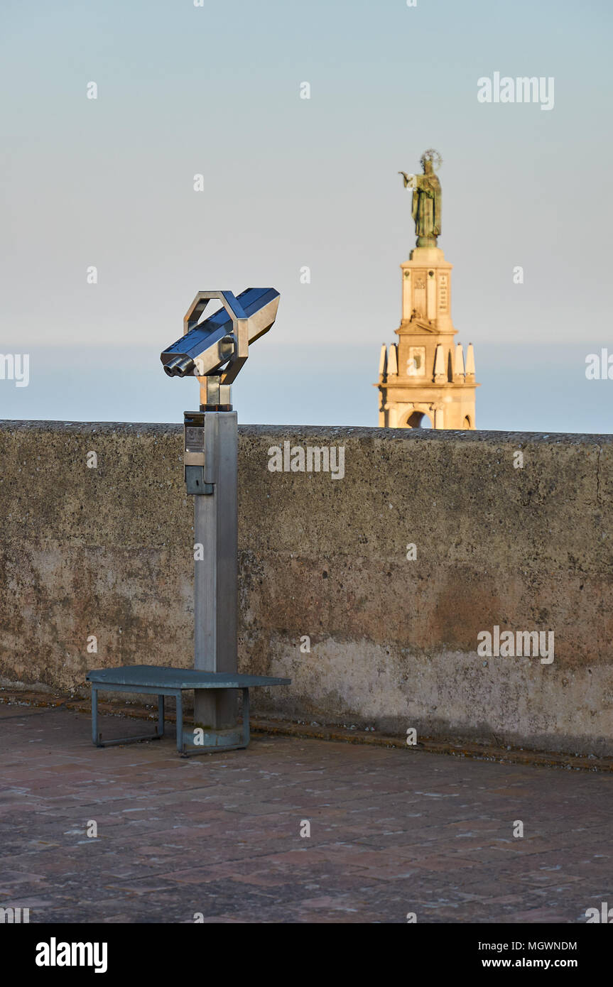 Telescope viewer at Sant Salvador Monastery rooftop pointing at big Christ statue in Sant Salvador Santuary (Felanitx, Majorca,Balearic Islands,Spain) Stock Photo