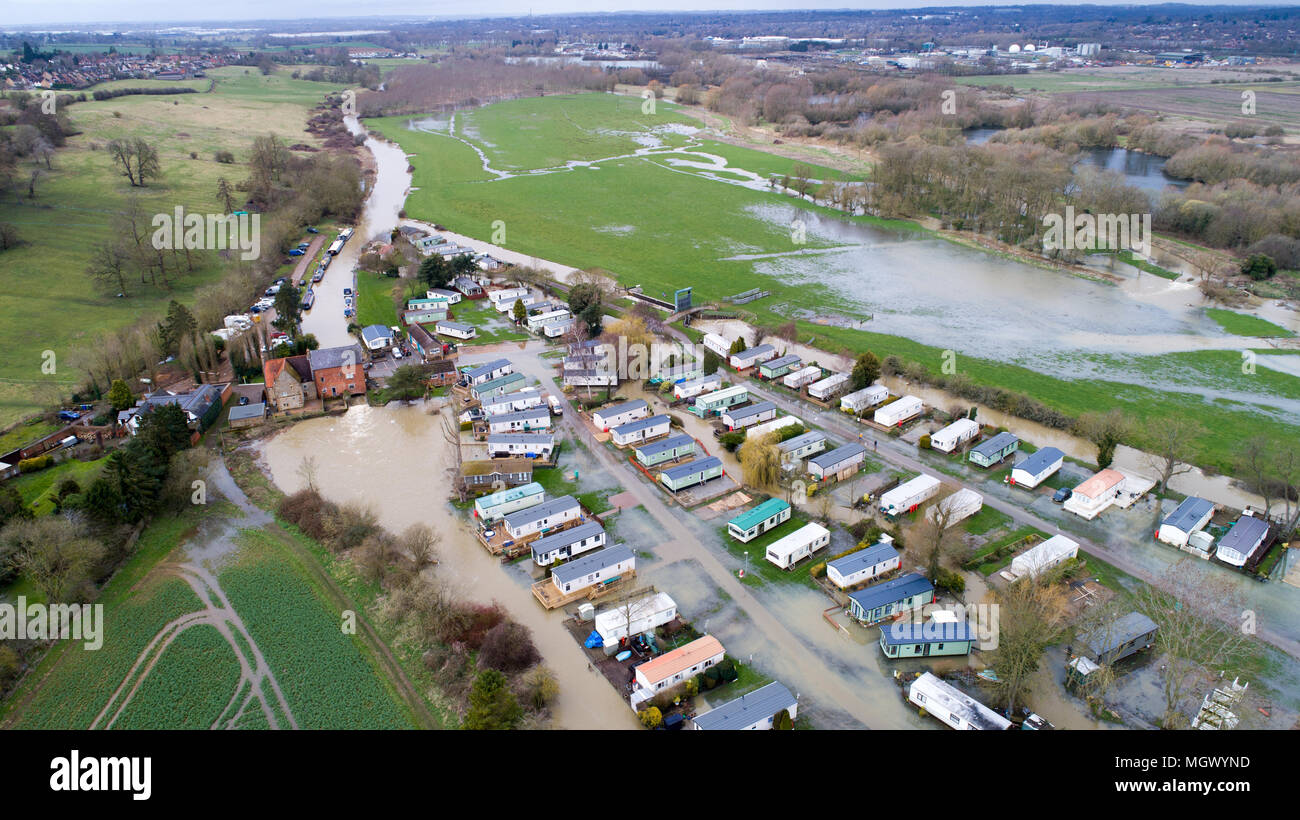 Aerial picture shows a caravan park in Cogenhoe,Northants,on Tuesday April 3rd partially flooded after the  River Nene burst its banks due to the recent heavy rain.  A caravan park has partially flooded today (Tues) after the River Nene in Northamptonshire burst its banks after another night of heavy rain.  The holiday park, which is on the river bank, is just one of many places in Britain which have flooded after days of wet weather.  Many roads remain closed today and The Environment Agency has issued 174 flood alerts and 23 flood warnings, covering almost every region of England and Wales. Stock Photo