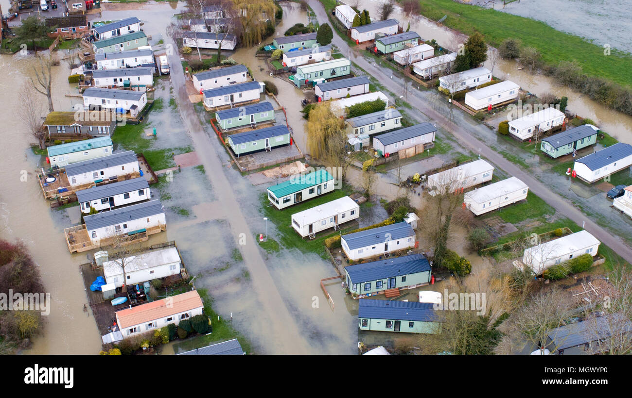 Aerial picture shows a caravan park in Cogenhoe,Northants,on Tuesday April 3rd partially flooded after the  River Nene burst its banks due to the recent heavy rain.  A caravan park has partially flooded today (Tues) after the River Nene in Northamptonshire burst its banks after another night of heavy rain.  The holiday park, which is on the river bank, is just one of many places in Britain which have flooded after days of wet weather.  Many roads remain closed today and The Environment Agency has issued 174 flood alerts and 23 flood warnings, covering almost every region of England and Wales. Stock Photo