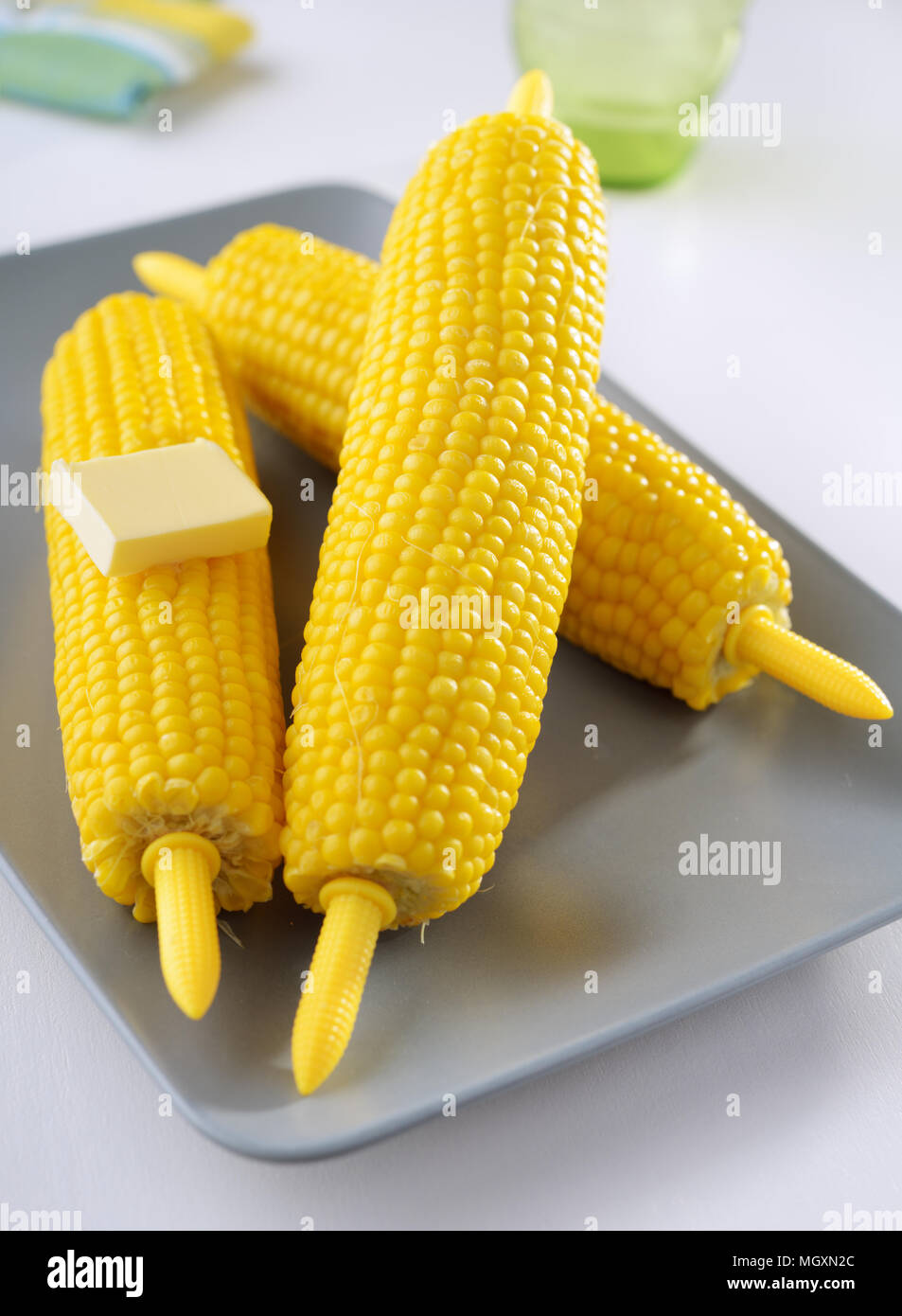 Steamed corn cobs on a plate Stock Photo