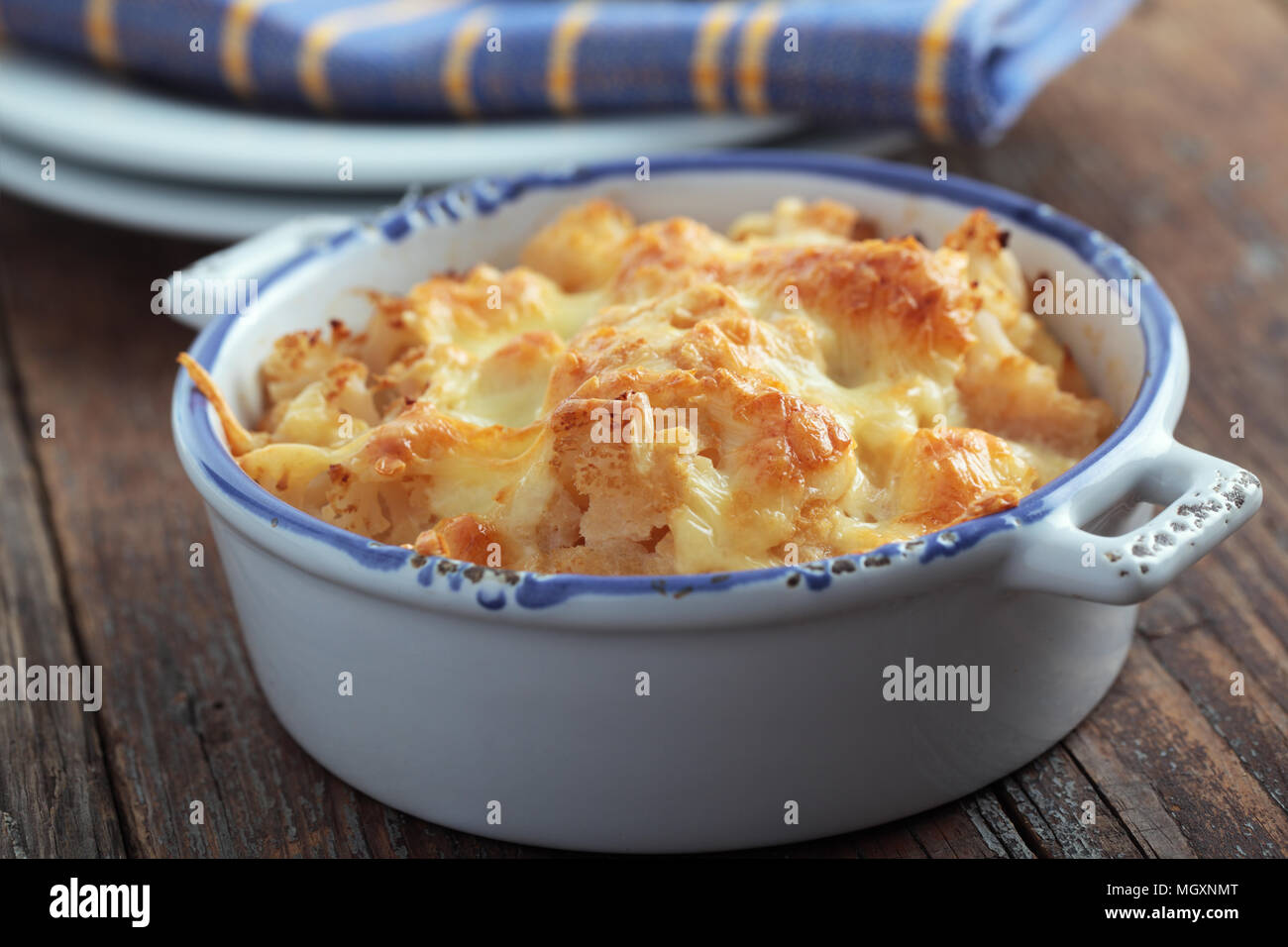 Cauliflower cheese in a baking dish Stock Photo