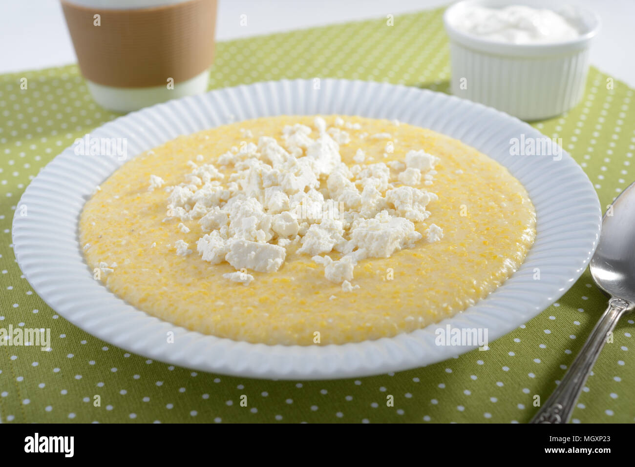 Polenta with feta cheese and greek yogurt Stock Photo Alamy