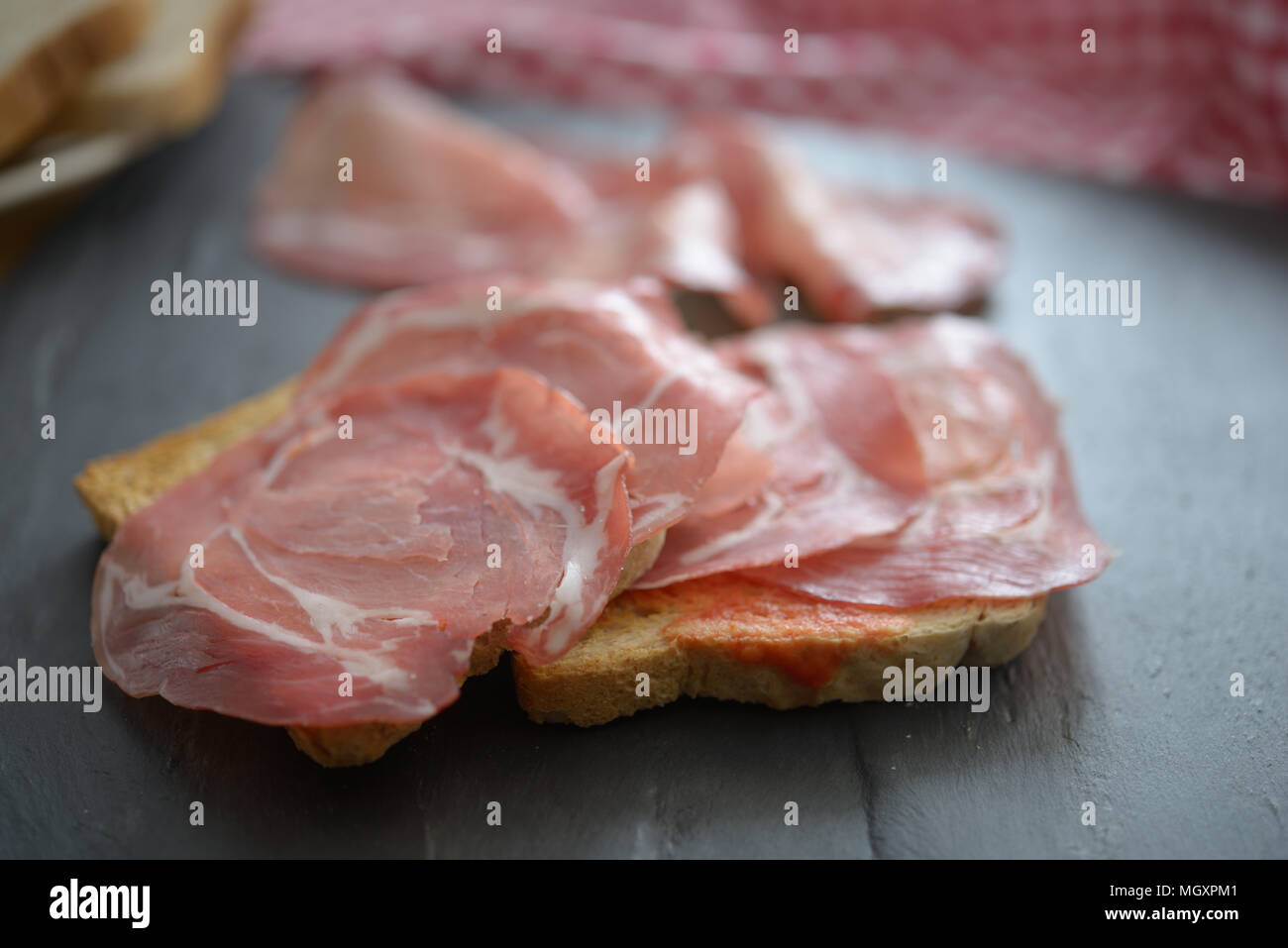 Sandwiches with jamon on a slate surface Stock Photo