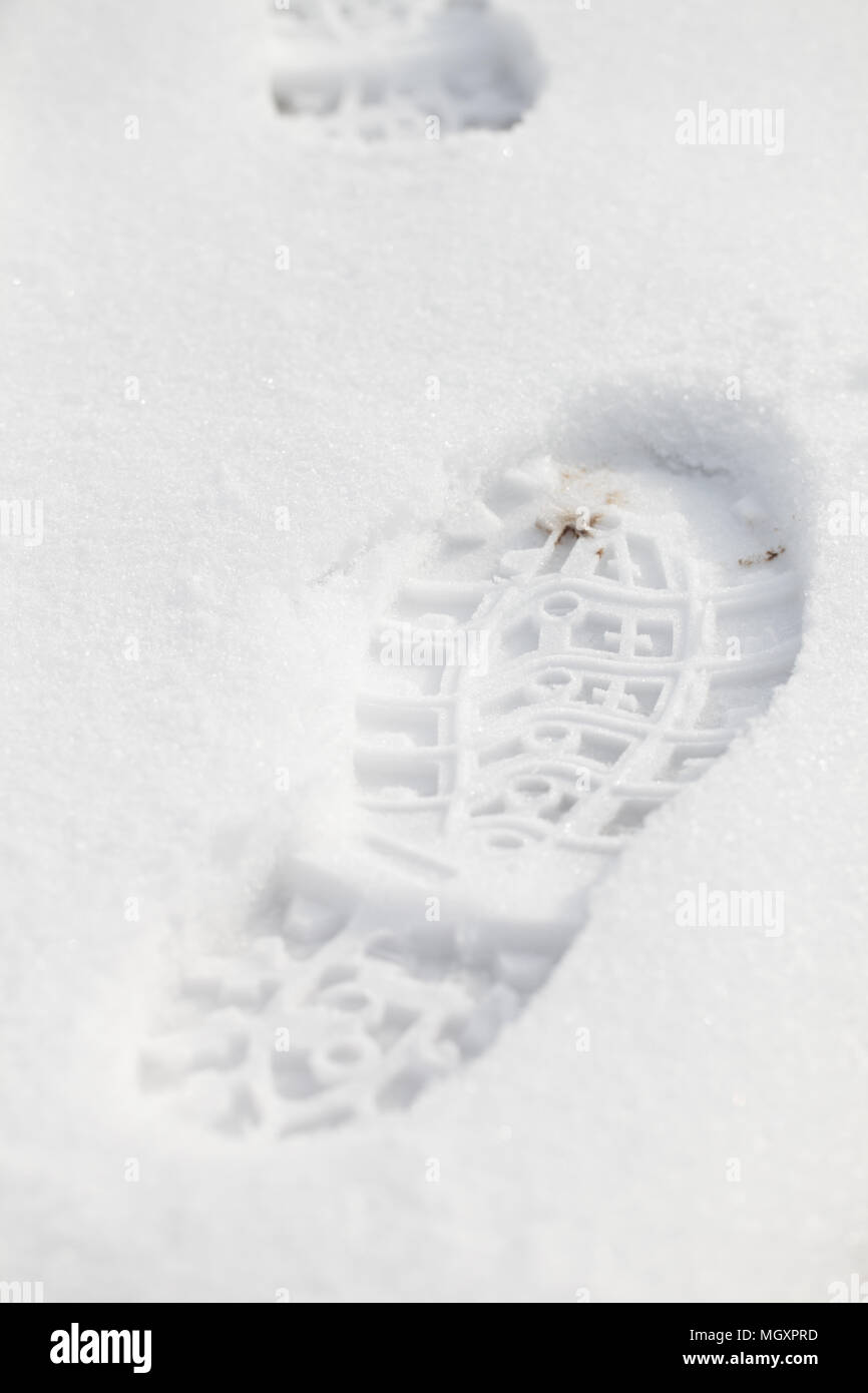 Boot trace on a fresh snow Stock Photo - Alamy