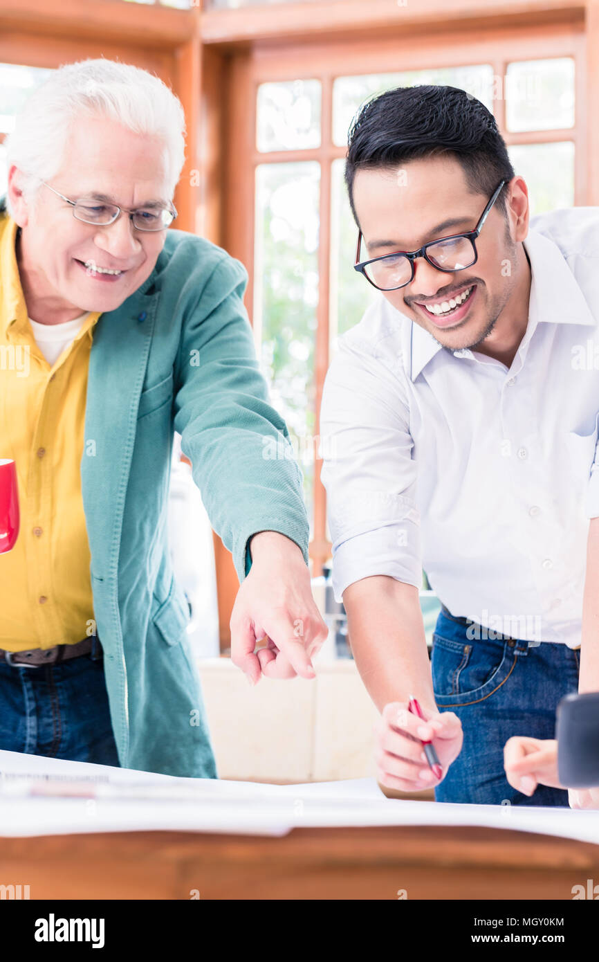 Cheerful professional team working on an innovative project Stock Photo