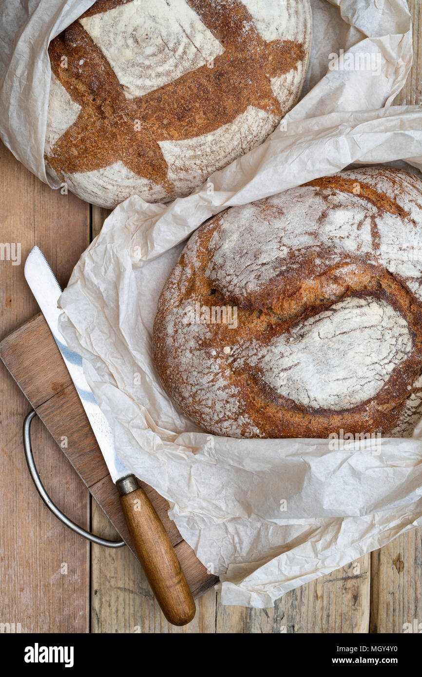 Sourdough bread and spelt sourdough bread on a bread board. UK Stock
