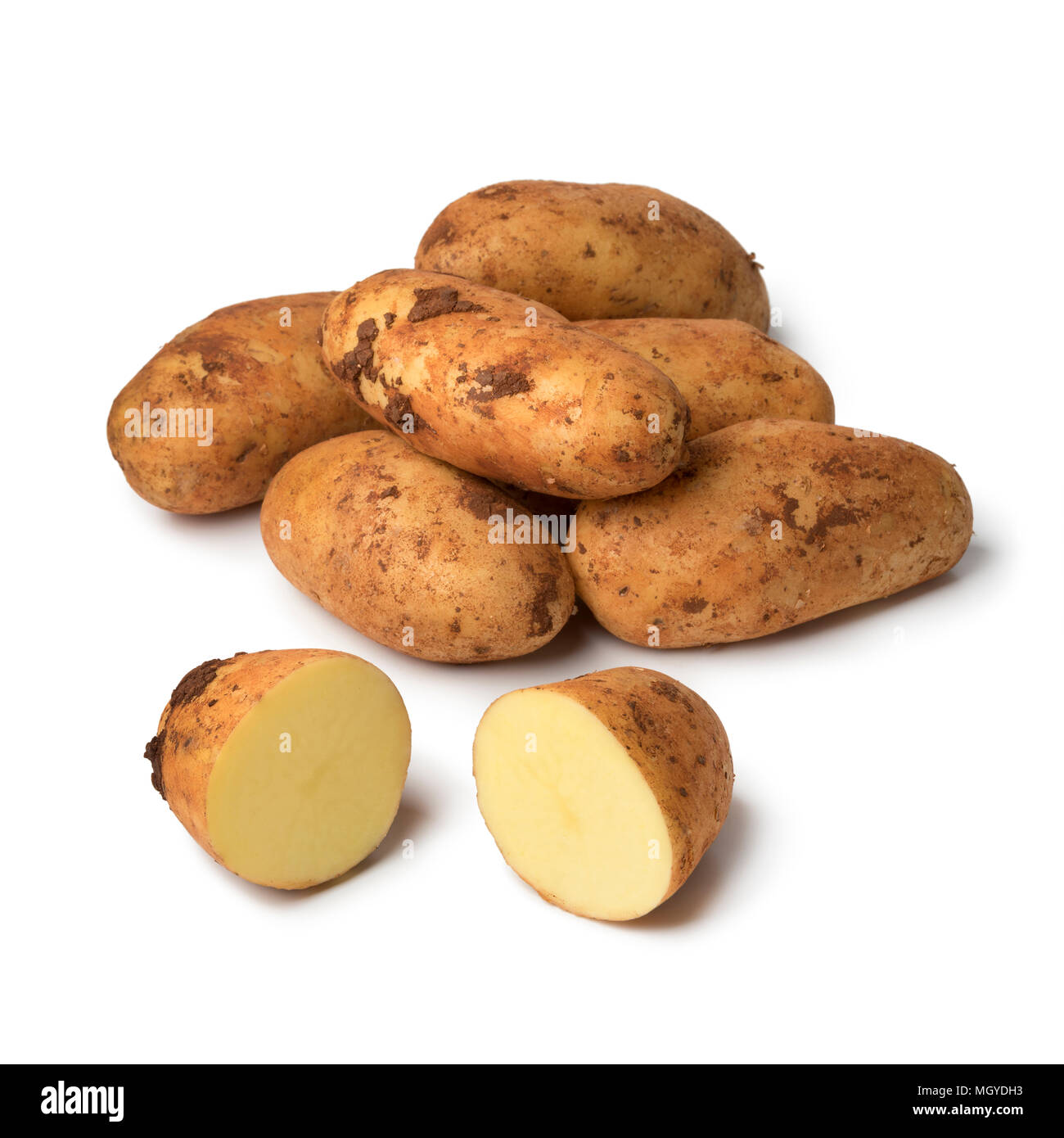 Fresh picked raw whole and sliced Diamant potatoes from Cyprus isolated on white background Stock Photo