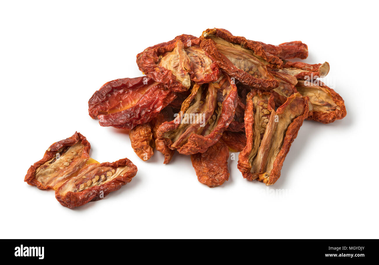 Heap of sun dried tomato isolated on white background Stock Photo