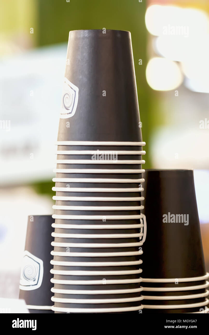 Rows of upside down brown cups of cardboard, paper for beverages