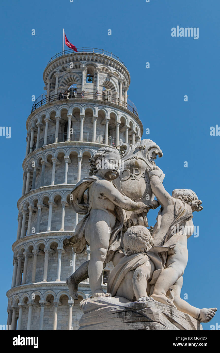 Detail of the Fontana dei Putti with the leaning tower in Piazza dei Miracoli, Pisa, Italy Stock Photo
