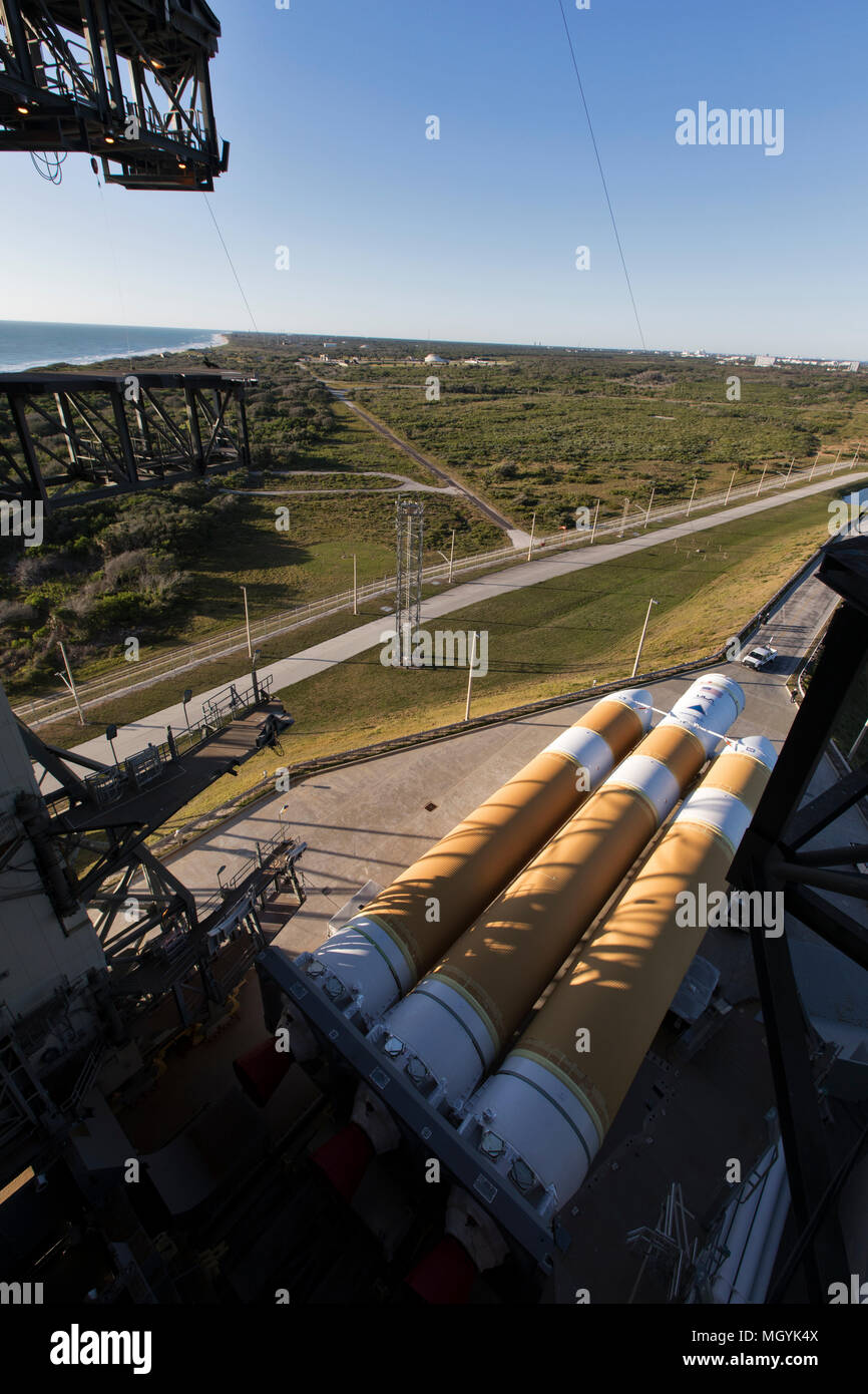 The first stage of a United Launch Alliance Delta IV Heavy rocket is prepared to be lifted into vertical launch position at the Vertical Integration Facility of Space Launch Complex 37 at Cape Canaveral Air Force Station April 17, 2018 in Cape Canaveral, Florida. The Delta IV Heavy will carry the NASA Parker Solar Probe mission into orbit in July 2018. Stock Photo