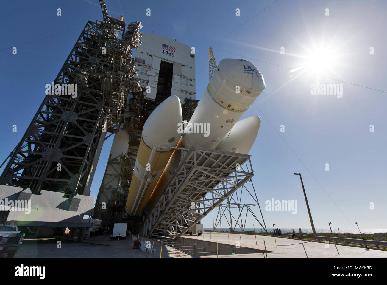 The first stage of a United Launch Alliance Delta IV Heavy rocket is prepared to be lifted into vertical launch position at the Vertical Integration Facility of Space Launch Complex 37 at Cape Canaveral Air Force Station April 17, 2018 in Cape Canaveral, Florida. The Delta IV Heavy will carry the NASA Parker Solar Probe mission into orbit in July 2018. Stock Photo