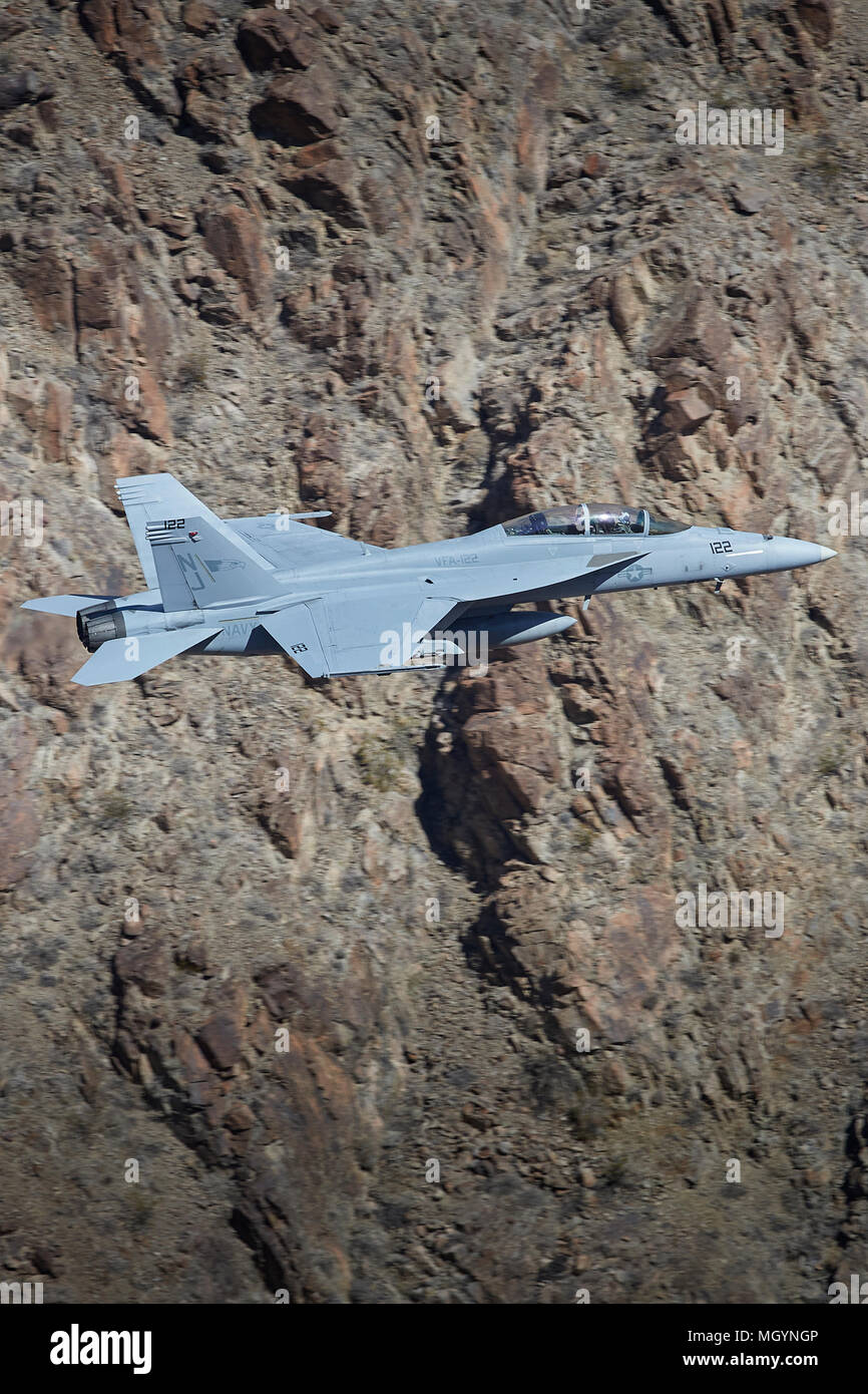 Close Up Profile View Of A United States Navy F/A-18F Super Hornet Jet Fighter, Flying At Low Level Through Rainbow Canyon California, USA. Stock Photo