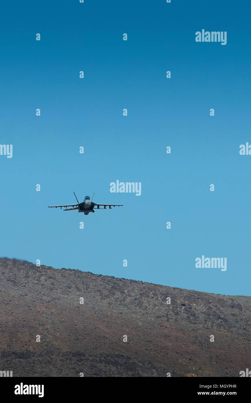 Head On, Close Up View Of A US Navy F/A-18F Super Hornet Flying Through Rainbow Canyon, California, USA. Stock Photo