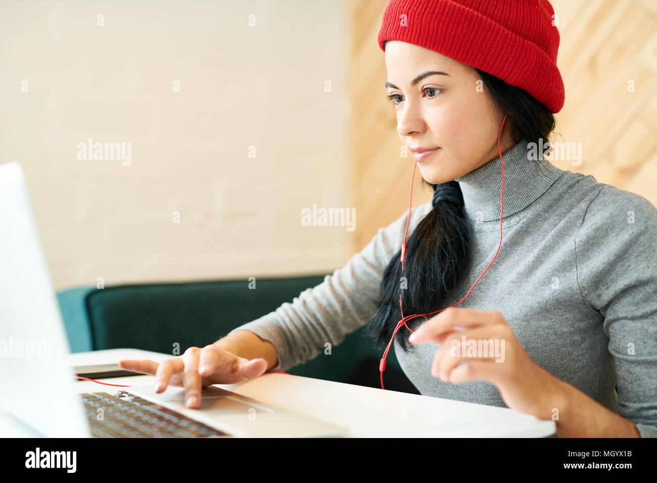 Young Woman Working in Cafe Stock Photo