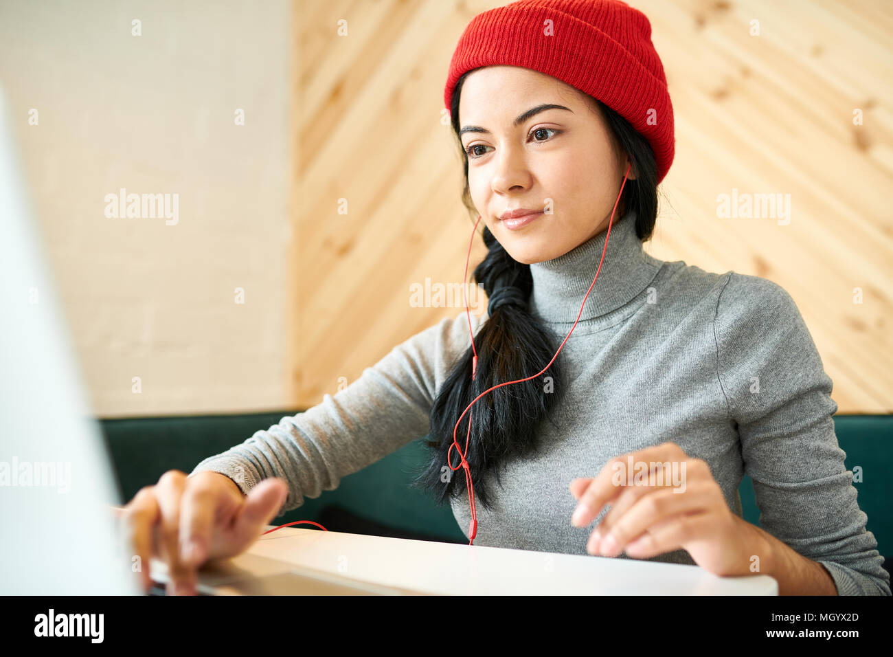 Young Woman Blogging in Cafe Stock Photo