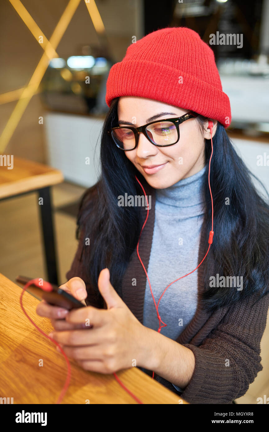 Trendy Young Woman using Smartphone Stock Photo