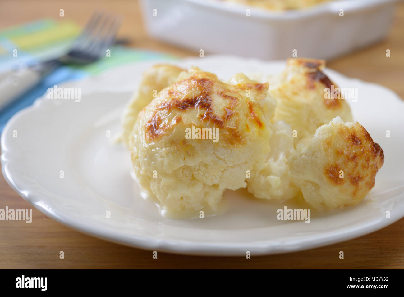 Cauliflower cheese on a plate closeup Stock Photo