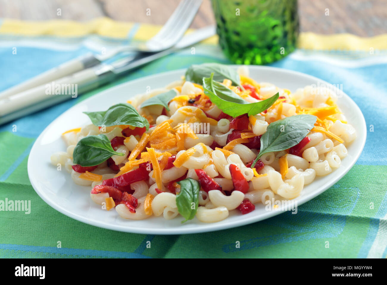 Pasta with cheese, basil leaves, and red pepper Stock Photo - Alamy