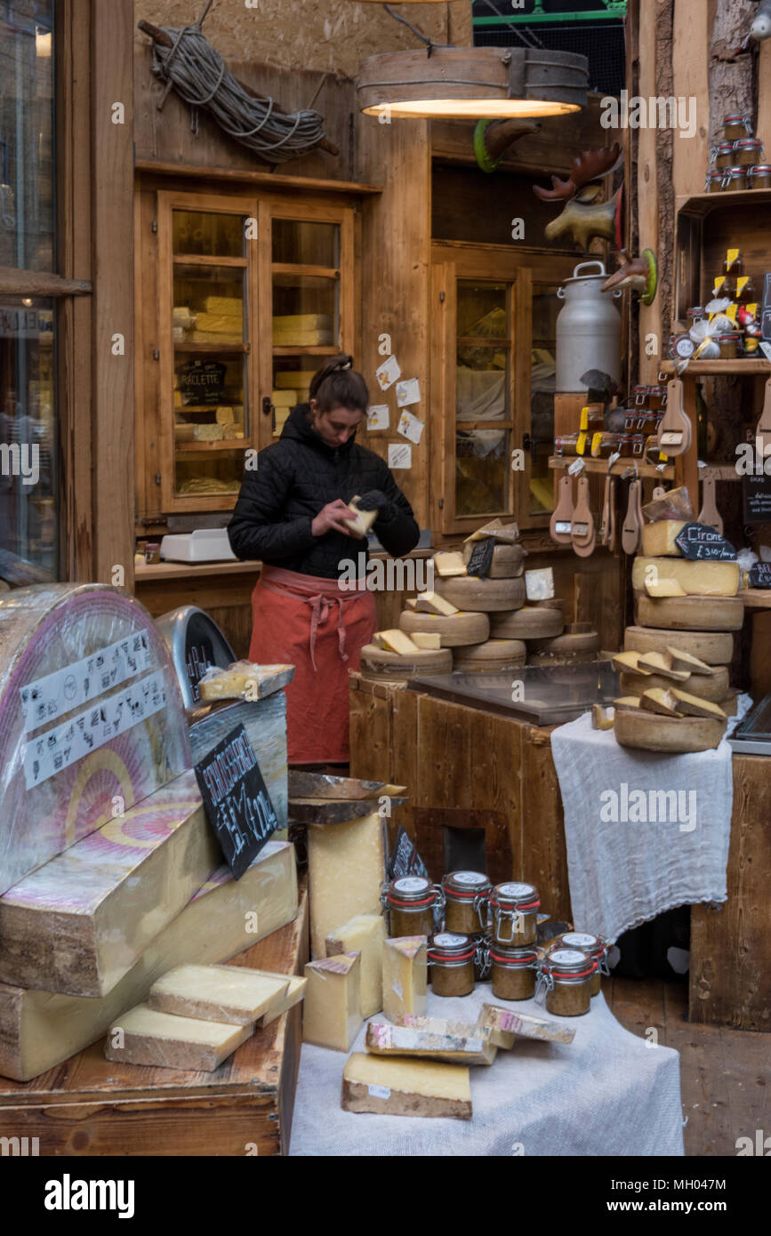 a high quality or upper class european delicatessen stall for cheeses at london's borough market. cheeses and farmhouse rustic foods products for sale Stock Photo