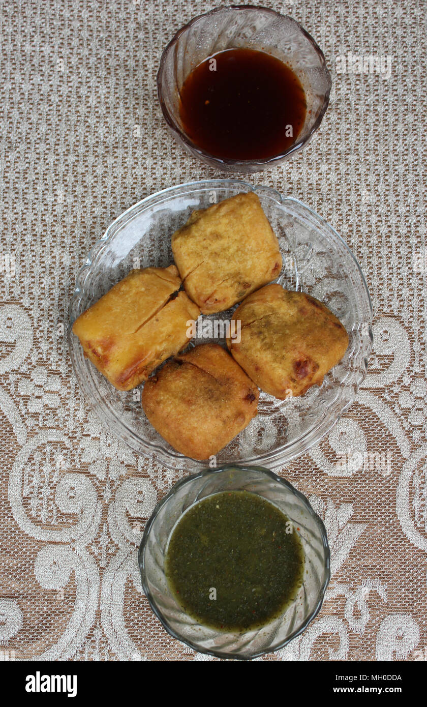 Cheese pakoras with red and green chutney Stock Photo