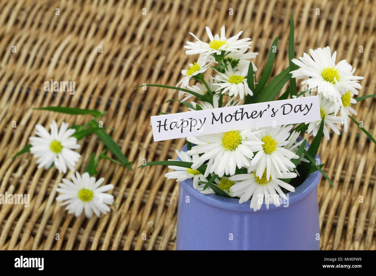 Happy Mothers day card with daisy flowers in blue vase on wicker ...