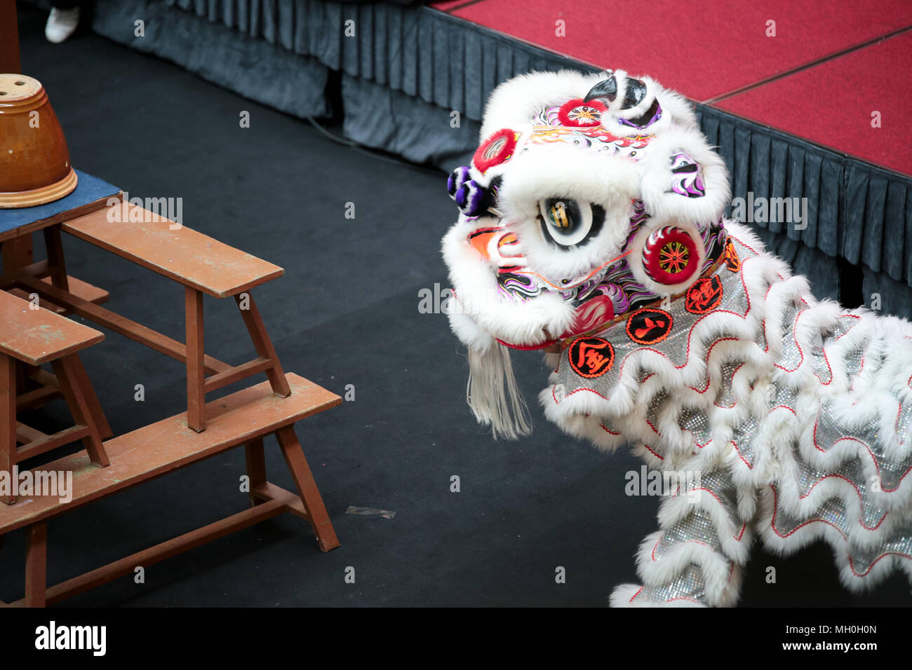 White color lion dance performing at VIVA HOME shopping mall in Kuala Lumpur, Malaysia. Stock Photo