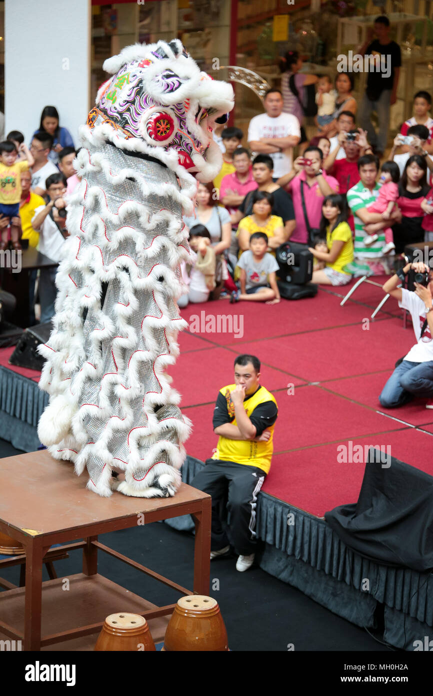 White color lion dance performing its stunts at VIVA HOME shopping mall