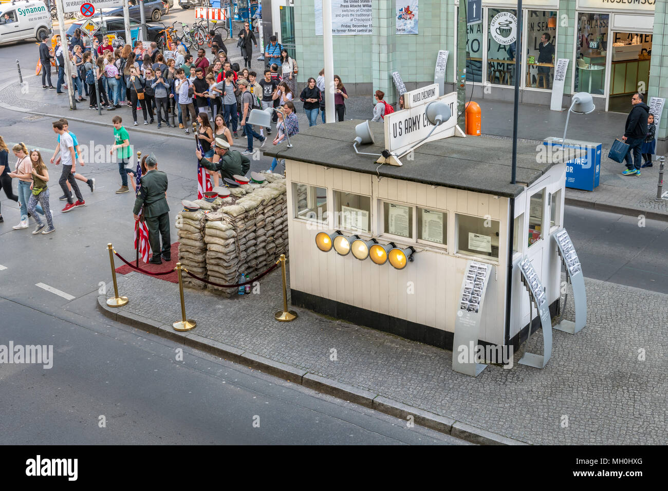 During the 'Cold War' Checkpoint Charlie used to be one of the most famous border crossings in the world. Nowadays it is a major tourist attraction in Stock Photo