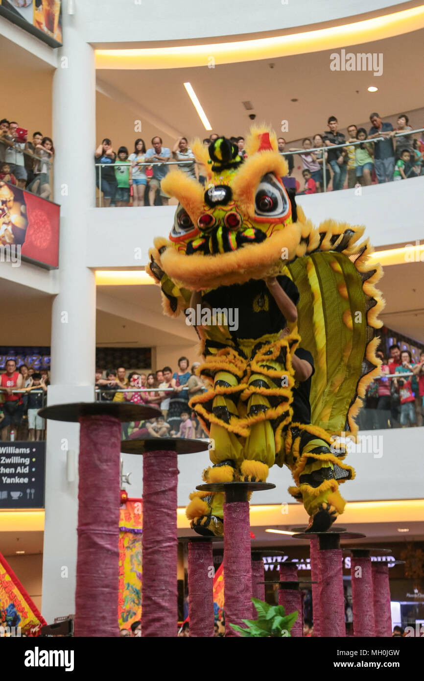 Lion dance performance on high pole at VIVA HOME shopping mall in Kuala