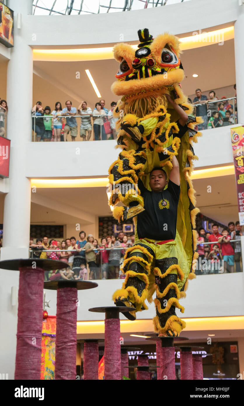 Lion dance performance on high pole at VIVA HOME shopping mall in Kuala Lumpur, Malaysia. Stock Photo