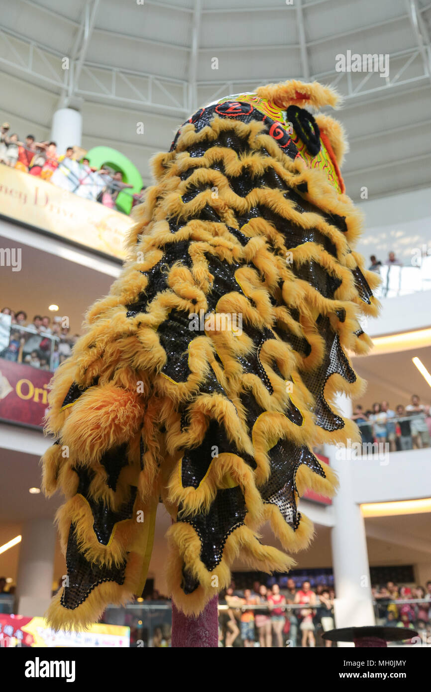 Lion dance performance on high pole at VIVA HOME shopping mall in Kuala