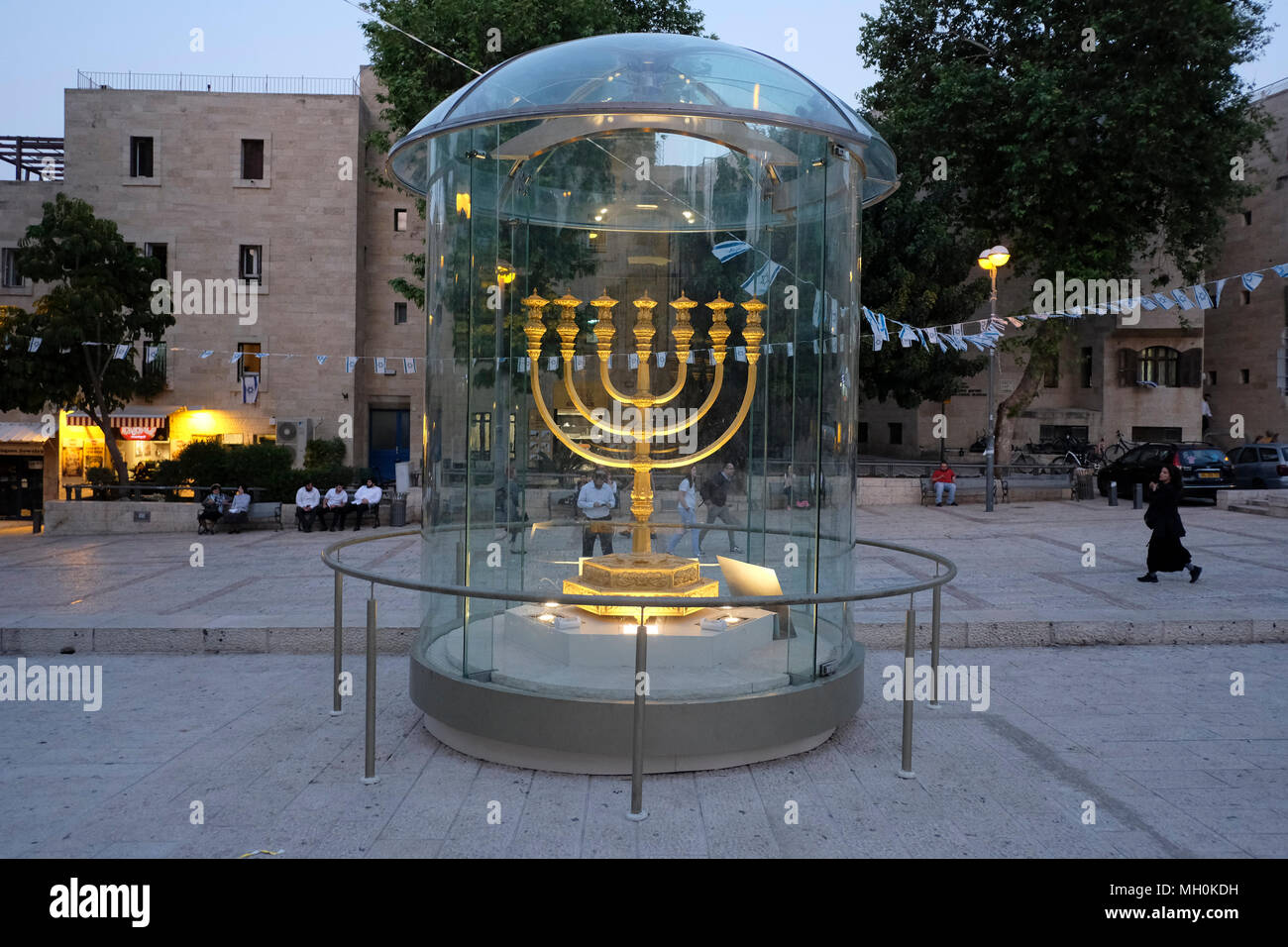 The massive solid gold menorah displayed inside a transparent case at