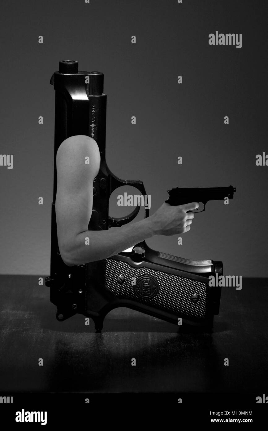 From an object personification / anthropomorphism surrealist photo series 'Machismo Ridiculoso' about masculinity and male gender stereotypes. Gun Stock Photo