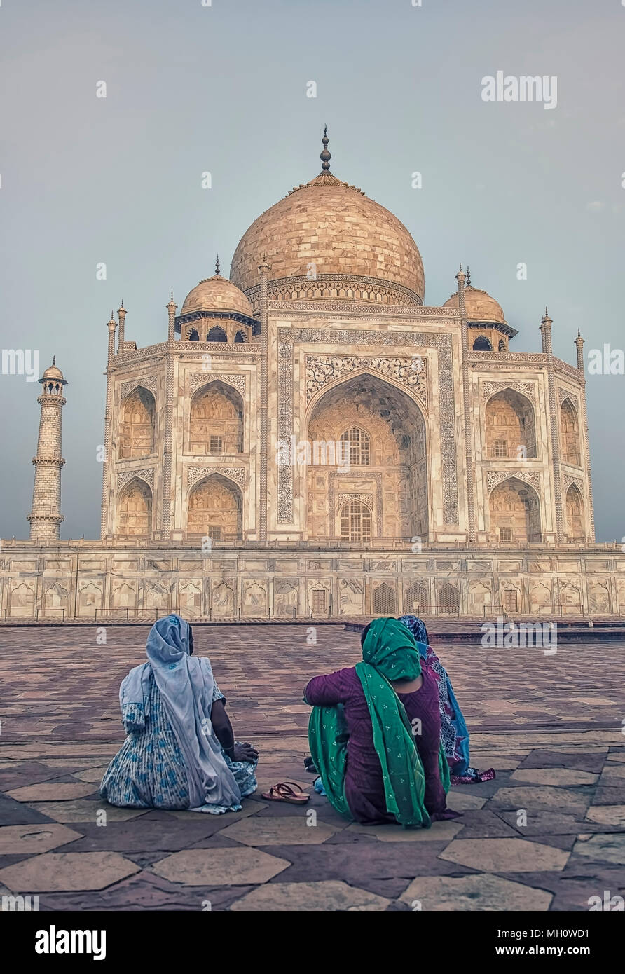 women contemplating the Taj Mahal in the morning Stock Photo