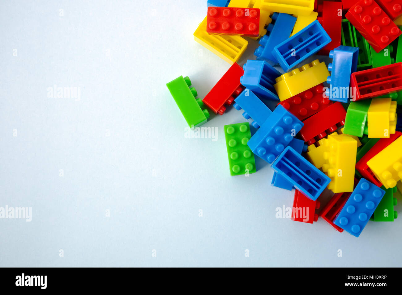 Colorful toy building blocks on blue background Stock Photo