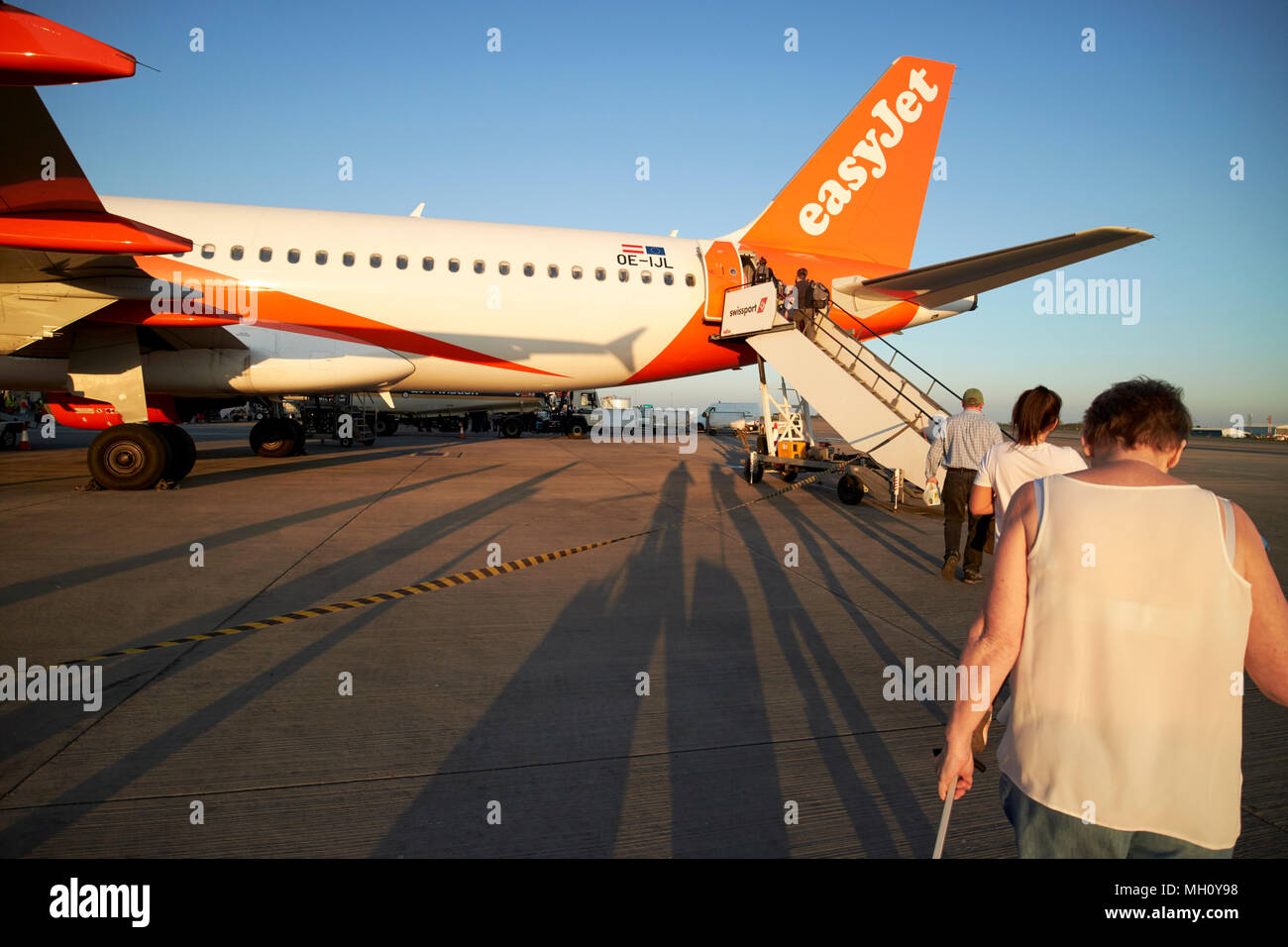 passengers boarding easyjet aircraft via the rear steps at bristol airport england uk Stock Photo