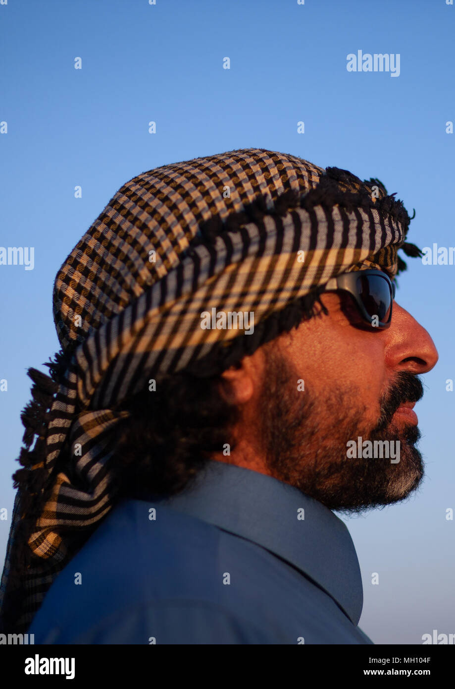 Side view of a bedouin in the desert, AlJawf Province, Sakaka, Saudi