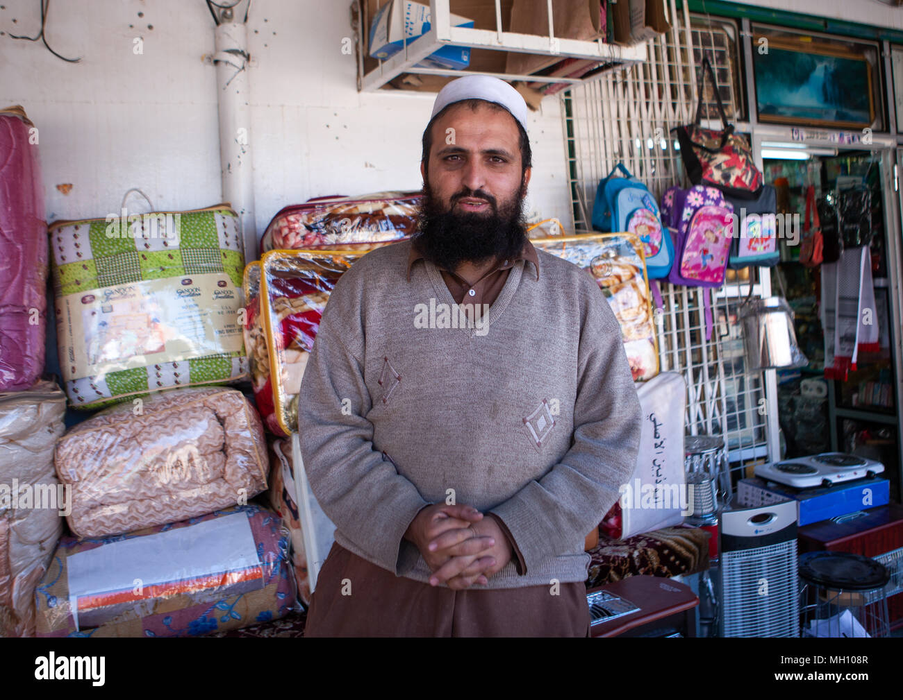 Foreign worker in a shop, Al Madinah Province, Al-Ula, Saudi Arabia Stock Photo